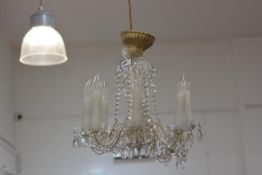 A modern crystal eight branch pendant light fitting mounted with crystal drops(one branch a/f) (h.