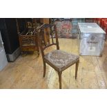 An Edwardian walnut side chair in the Adam taste with harebell and pedimented carved top, with
