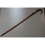 A Bavarian Grindelwald treen carved horn handled walking stick with hoof and steel tapered end (l.
