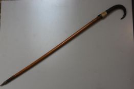 A Bavarian Grindelwald treen carved horn handled walking stick with hoof and steel tapered end (l.