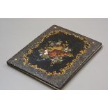 A Victorian papier mache mother of pearl folio cover with handpainted floral decoration enclosed