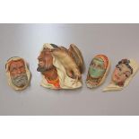 Bossons: a collection of three Arab moulded wall masks, including a figure with a Hawk and and