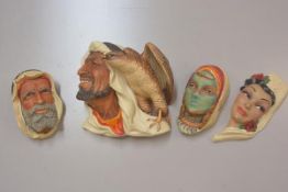 Bossons: a collection of three Arab moulded wall masks, including a figure with a Hawk and and