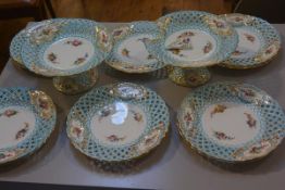 A Minton twelve piece dessert service with pierced basket enamelled border and floral and gilt