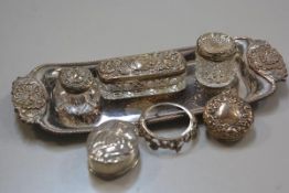 A Sheffield plated rectangular snuffer/pen tray, a white metal oval chased pill box, two silver