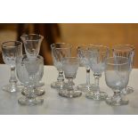 A pair of 19thc crystal tapered cordial glasses raised on domed feet, a crystal thumb cut glass,