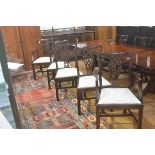 A set of six plus two Chippendale style mahogany pierced splat back dining chairs, with slip in