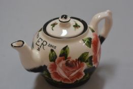 Commemorative ware: A Griselda Hill pottery Wemyss Queen Elizabeth II 50th Anniversary teapot,