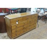 A modern pine chest of drawers, the rectangular top over three frieze drawers above two banks of