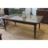 A Victorian mahogany wind-out dining table, the rectangular top with rounded corners on tapering