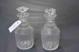 A pair of Regency triple-ring neck cut-glass decanters. 21cm