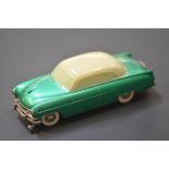 A Prameta Automodelle Opel Kapitan 555 clockwork model car in metallic green with a cream roof.