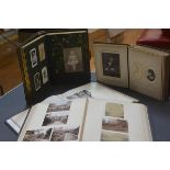 A group of four Victorian photograph albums, two with portrait photographs, one with Oxford scenes