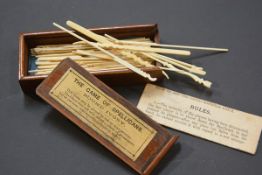 An Edwardian mahogany cased set of ivory Spellicans. 12cm