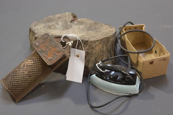 A late 19th/early 20th century metal nutmeg grater; a vintage toy iron; and a fossilised tree