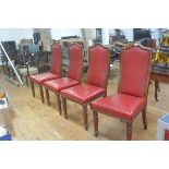 A set of four 19thc mahogany upholstered arched panel back dining chairs with studded detail, in red