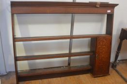 A George III oak dresser rack, with moulded cornice, fitted to one side with a cupobard door