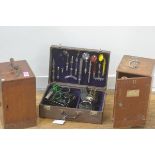 A box containing two microscope cases and a Frequenta by Velmag of Leipzig electro therapy