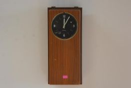 A vintage Telesect wall-mounted electric clock. 60cm