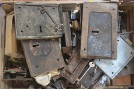 A box containing a quantity of 19th century and later locks and plates, some with keys.