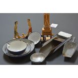 A group of toy and other enamel scoops and dishes; together with two articulated wooden toys.