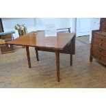 A 19th century mahogany dropleaf dining table, the rectangular top raised on rectangular-section