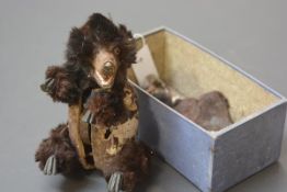 A late 19th century clockwork mechanical toy bear, possibly Ives Blakeslee, with ebonised wooden