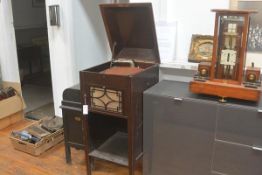 A cabinet gramophone, the Aeolian Vocalion, in a mahogany case (lacking winder).