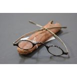 A small pair of 19th century tortoiseshell and white metal spectacles, cased. Width 11.5cm