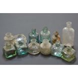 A group of 19th century coloured and clear glass ink bottles, various sizes.