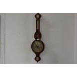 A late George III mahogany banjo style barometer with satinwood and ebony strung border, complete