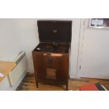 An HMV floorstanding mahogany cased radio gramophone, 1940's (poor condition). 90cm by 63cm