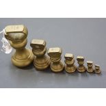 A group of seven assorted 19th century brass baluster weights, largest 1lb. (7)