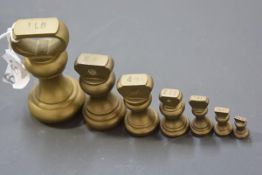 A group of seven assorted 19th century brass baluster weights, largest 1lb. (7)