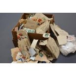 A cardboard box containing a loose stamp collection, GB and World, mostly 20th century
