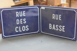 Two French blue enamel street signs, "Rue des Clos" and "Rue Basse". (2) 31cm by 40cm