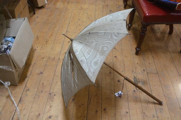 A late Victorian white-metal mounted parasol with gilt satin birch handle. 100cm