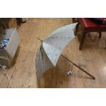 A late Victorian white-metal mounted parasol with gilt satin birch handle. 100cm