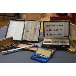 Three boxes of glass laboratory slides together with three boxes of assorted instruments including