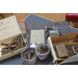 A group including chisels, a gramophone movement and a jewellery case.