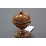 A 19th century ivory-mounted walnut string holder, of spherical form, with urn finial. 15.5cm