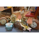 A group of vintage clocks including a Smiths Enfield painted metal wall clock; a 1940's twin-light