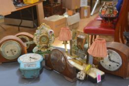 A group of vintage clocks including a Smiths Enfield painted metal wall clock; a 1940's twin-light