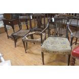 A group of three chairs: a Regency sabre leg dining chair and two Edwardian mahogany dining