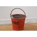 A vintage red enamel painted metal fire bucket, with swing handle. Height exc. handle 29cm