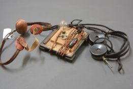 A pair of bakelite 2000 Ohm crystal radio set headphones, a table top bulb and a padded brace. (3)