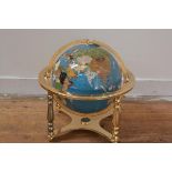 A modern specimen mineral terrestrial globe, mounted on a brass stand with gimbal. Height 44cm