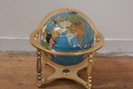 A modern specimen mineral terrestrial globe, mounted on a brass stand with gimbal. Height 44cm