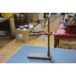 A vintage treen turned wooden test tube holder, the adjustable arm with screw-turn clamp. Height