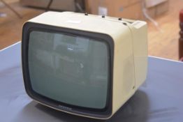 A vintage Grundig plastic-cased portable television. 25cm by 30cm